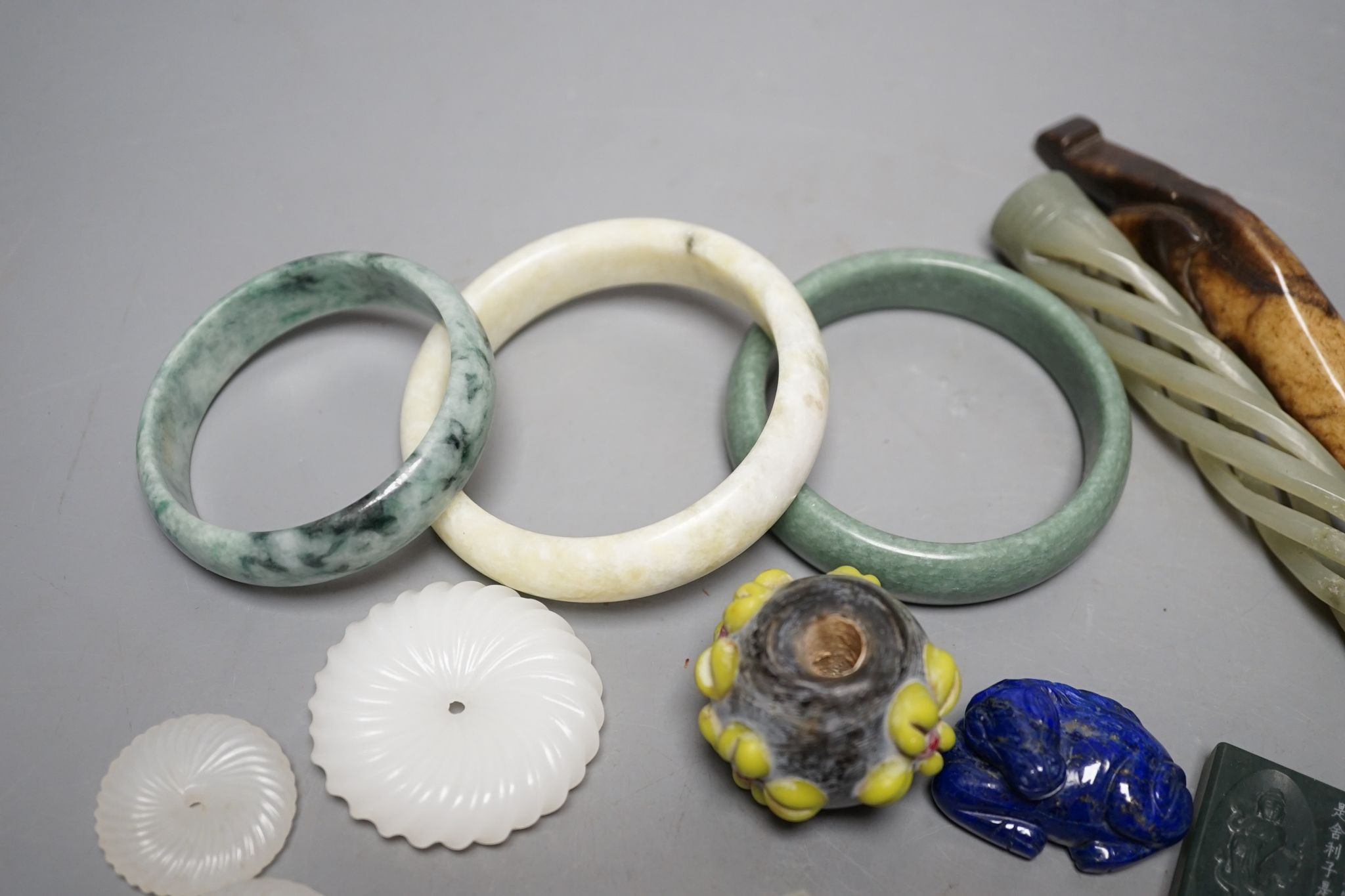 A group of Chinese carvings, including three bangles